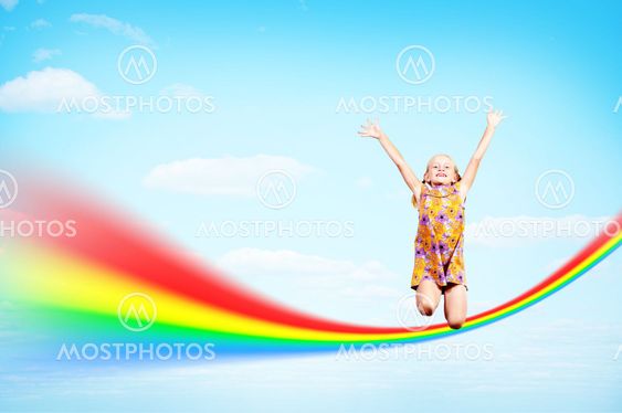 girl jumping on clouds and a rainbow