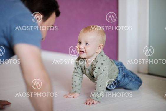 Little boy playing with his father