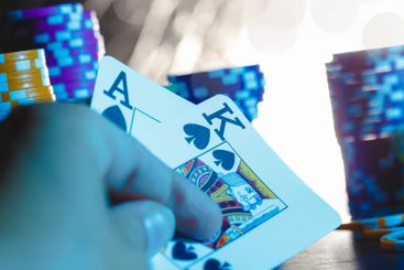 Poker game set of cards and chips close up