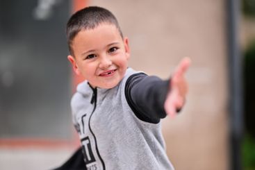 Children playing together in a park or engaging in a game.