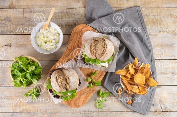 Healthy vegan burger with fresh vegetables and yogurt sauce