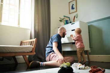 Getting ready, children and a man helping his son to...