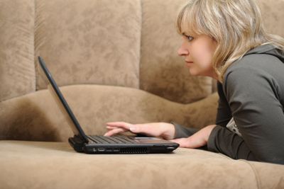 The woman working on laptop at home