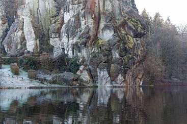 Large rocky rocks on a background of water. Rocks of...