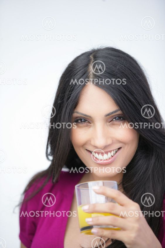 Woman with a glass of orange juice