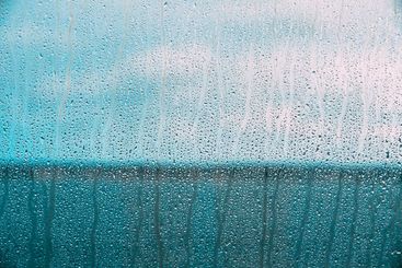 Drops Of Water Or Rain On Wet Glass Background. Moody...