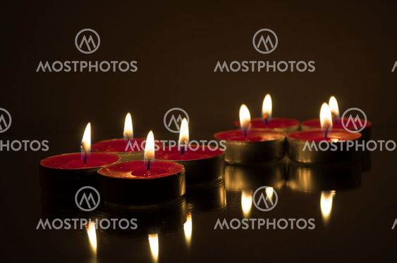 Eight Reflected Tea Candles