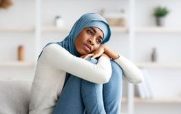 Depression Concept. Upset Black Young Muslim Lady In...