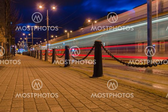 Trail of light left by tram at night