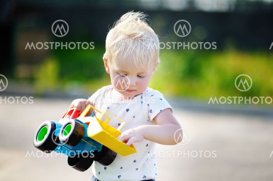 Boy playing with car toy