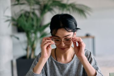 A close up portrait of a young businesswoman engaged in...