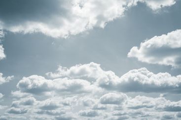 Dramatic overcast sky with gray clouds forming moody and...