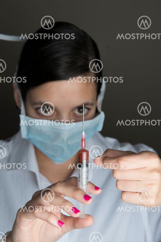 Beautiful women holding syringe