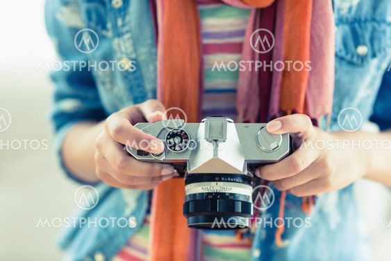 Young woman looking at her camera