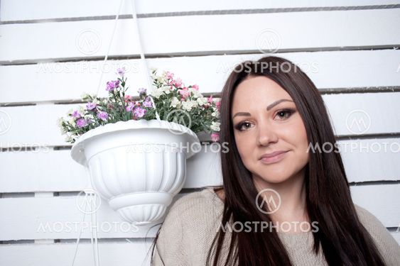 The young girl is engaged in flowers
