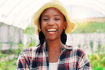 Laugh, greenhouse and portrait of woman on farm with...