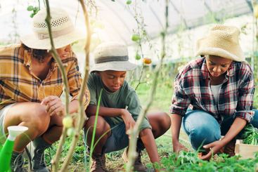 Farmer, plant and garden with family in greenhouse for...