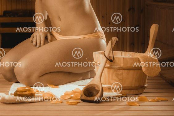 Closeup of woman relaxing in sauna. Spa wellbeing.