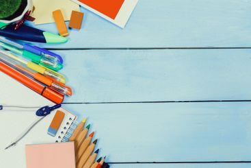 Colorful stationery and school supplies arranged on a...