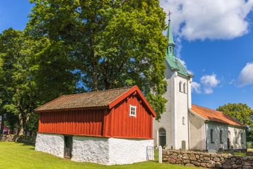 Church and an old shed in the Swedish countryside