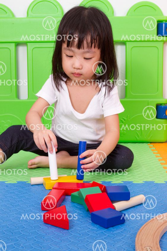Asian Chinese children playing with blocks