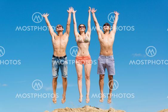 young friends jumping