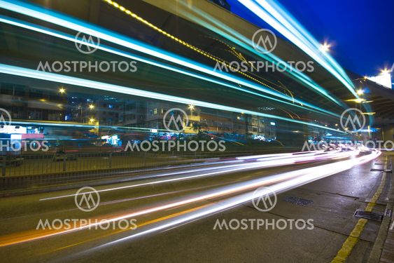 Modern Urban City with Freeway Traffic at Night