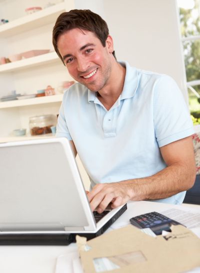 Young man working with laptop computer