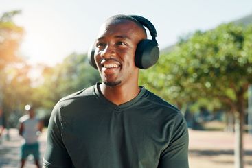 Fitness, headphones and man outdoor for music, streaming...