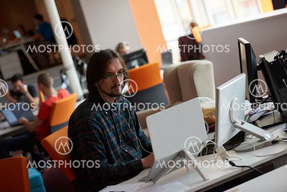 startup business, software developer working on computer