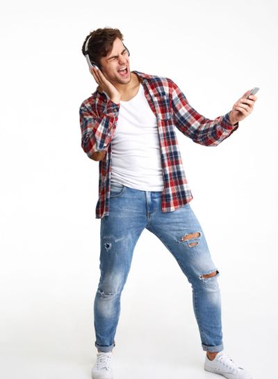 Full length portrait of a cheerful attractive man