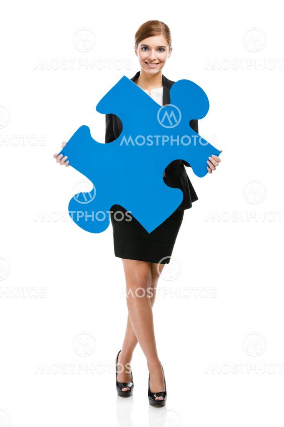 Businesswoman with a puzzle piece