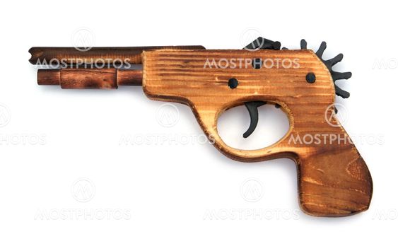 Toy wooden gun , on a white background