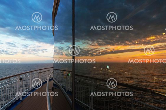 Reflection from the restaurant at a ferry with a sunset...