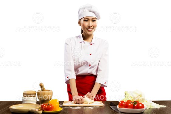 Asian female chef cooking pizza dough