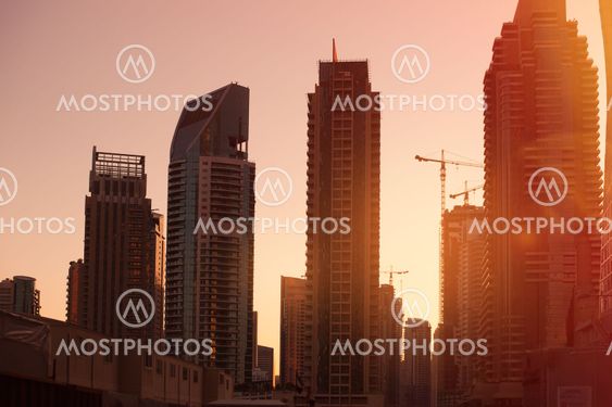 construction of high-rise buildings on background sunrise