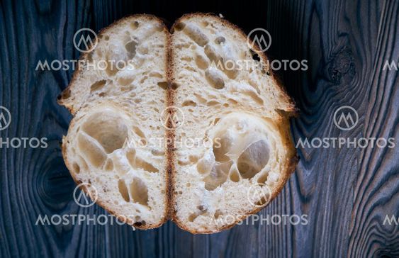 Homemade tartine bread on dark wooden table
