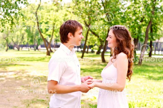 couple holding hands in the park