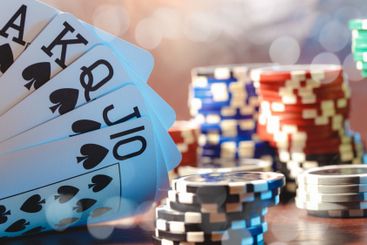 Poker game set of cards and chips close up