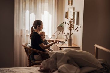 Woman working at home with her baby