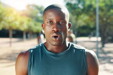 Fitness, tired and black man with breathing outdoor for...