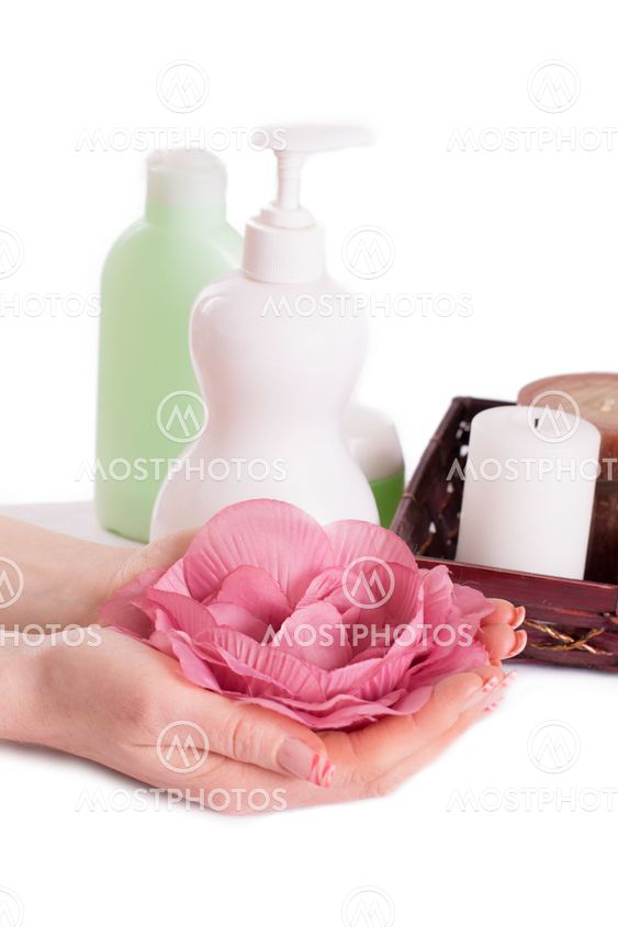 Woman hands with manicure and hand care products