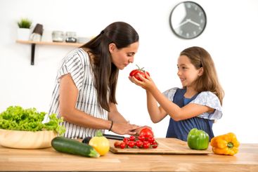 Mother and daughter cooking