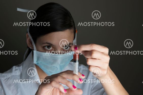 Beautiful women holding syringe