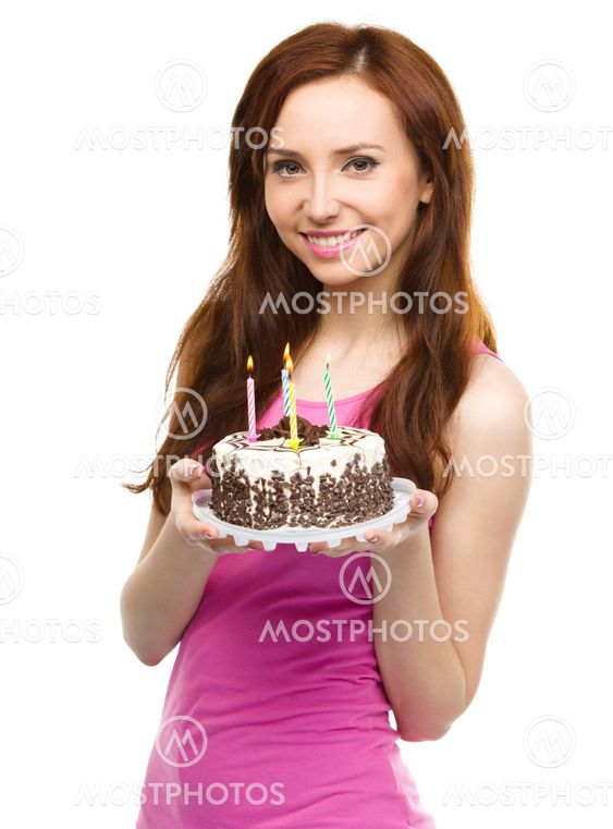 Young woman with anniversary cake