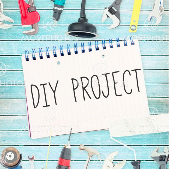 Diy project against tools and notepad on wooden background