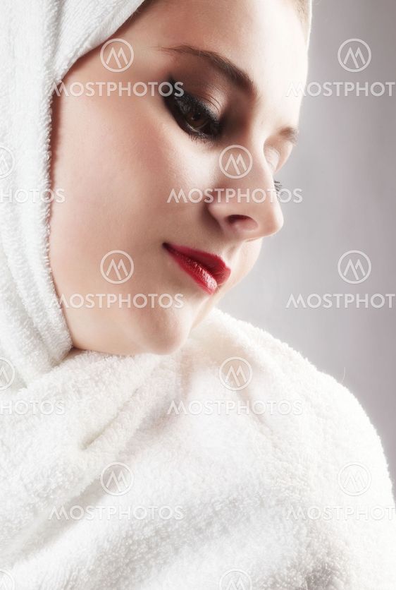Young beautiful girl in the sauna towel