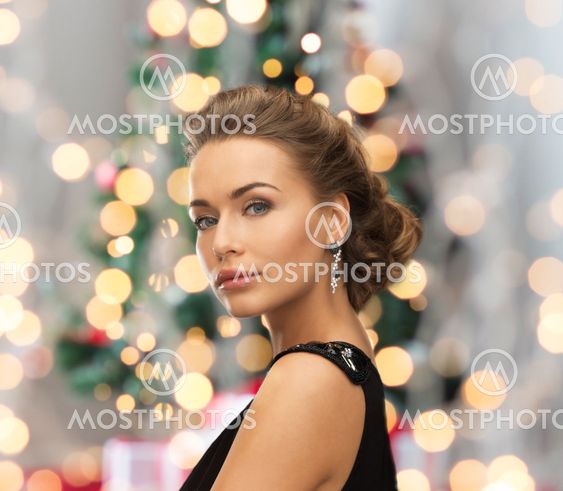 beautiful woman in evening dress wearing earrings
