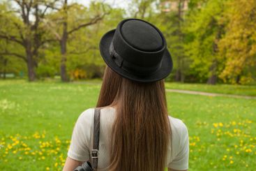 Brunette woman outdoors. Portrait of young beauty model