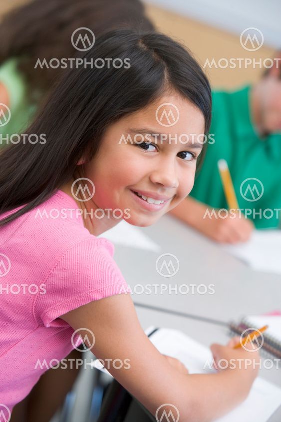 Female pupil in elementary school classroom
